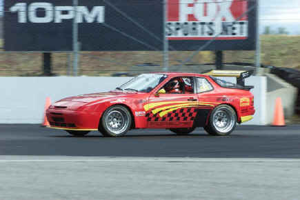 Andy Plastiras
Andy purchased this '86 turbo 2 1/2 years ago, ran it basically stock, tracking in fall '99, 8 days,  then in 2000 approx. 30 days. Last winter, widebody fiberglassed; turbocup suspension; tire upgrade. For the time being, it is 217 HP, chipped, making a possible 260HP. Some people don't believe it. Taking an inherently well balanced car, radicalize the concept, have people around you totally trust, trust in the machine that you have, and know that you drive the car to the limit but not over the limit, can be sensational fun.
