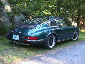 Bob Tucker
73 911 T coupe - Over the 8 years I have owned this VERY fun car it has seen many modifications. It's as much fun to work on as it is to drive. The paint work was first in '96, color is Amazon Green. The original 2.4 L CIS engine was replaced with a basically stock '78 3.0 two years later. It's current configuration is:

Engine: '78 3.0 L 9.5:1 CR, GE-60 cams, ported and polished, Weber IDA 40, MSD 6AL ignition unit with Blaster coil, although not dyno'd (yet) power output is approx 250 HP.

Transmission: 915 with updated hubs and syncs with low ratio differential, short shift kit.

Brakes: '87 Carrera calipers front and rear with cross drilled rotors and Pagid orange pads.

Suspension: 23 mm front and 30 mm rear torsion bars with adjustable spring plates and stiff bushings all around, 22 mm front and 19 mm rear anti-sway
bars.

Body: Weight 2400 lbs (that's without me), RSS front air dam, 2 front oil coolers (one fender and one front), Sparco Evo 2 drivers seat and Recaro SRD recliner both with 6 point Schroth harnesses.

Wheels: Street- Fuchs 6 and 7 X 16 with Yokohama 205/45 16 AVS Intermediate, Track Cookie Cutter 6 and 7 X 15 with Michelin 205/50-15 Sport Cup.
